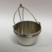 A plain French silver tea strainer with gilt inter
