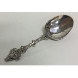 A Continental silver spoon with cast handle. Appro