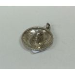 A miniature Continental pendant in the form of a s