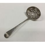 A pierced silver sifter spoon cast with flowers an