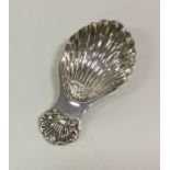 A small Edwardian silver caddy spoon with fluted b