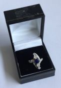 An attractive sapphire and diamond cocktail ring i