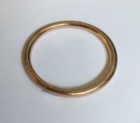 A 9 carat gold plated slave bangle. Est. £30 - £50