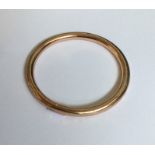 A 9 carat gold plated slave bangle. Est. £30 - £50