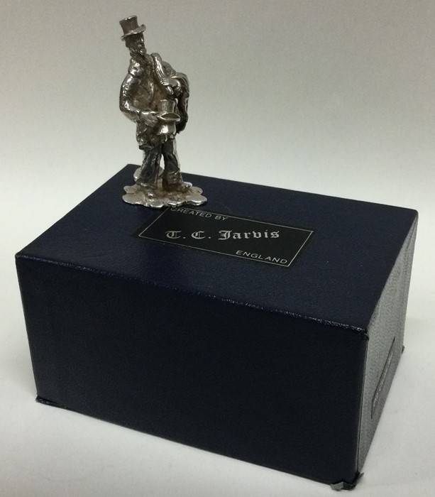 A cast silver figure of man in presentation case w