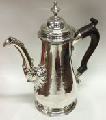 A massive George II silver tapering coffee pot on