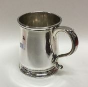 A heavy George II silver mug on spreading base. Lo