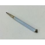 A small Continental silver and enamelled pencil. A