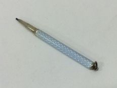 A small Continental silver and enamelled pencil. A