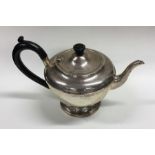 An Edwardian silver teapot of circular form. Birmi