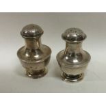 A silver two piece cruet set of shaped form. Birmi