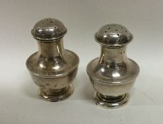 A silver two piece cruet set of shaped form. Birmi