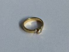 An 18 carat gold and diamond mounted ring with rub