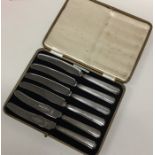 A boxed set of six silver handled tea knives. Est.