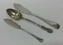 Two silver butter knives together with a preserve