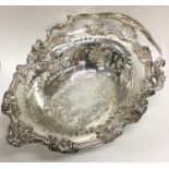 A magnificent George III silver basket of Rococo d