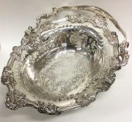 A magnificent George III silver basket of Rococo d