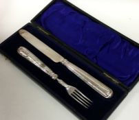 A cased silver two piece christening set. Est. £20