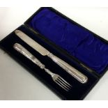 A cased silver two piece christening set. Est. £20