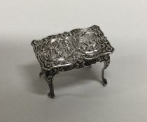 A miniature chased silver table. Birmingham. By L&