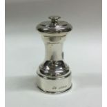 A circular silver pepper grinder. Birmingham. By E