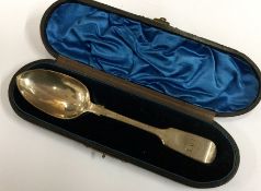 A cased fiddle pattern silver dessert spoon. Londo