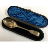 A cased fiddle pattern silver dessert spoon. Londo