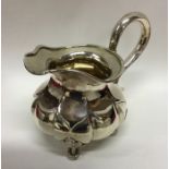 RUSSIAN: An attractive silver cream jug with cast