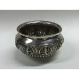 An Indian silver sugar bowl of half fluted design