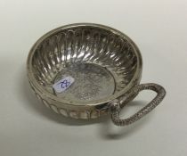 An Antique silver wine taster with scroll decorati