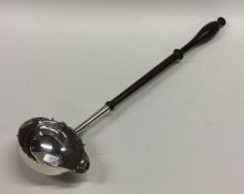A large George II silver toddy ladle with turned h