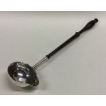 A large George II silver toddy ladle with turned h