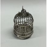 A novelty silver table toy in the form of a Chines