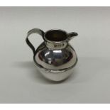 A miniature silver jug in the form of a Jersey Can
