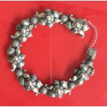 A stylish silver bracelet with concealed clasp. 24