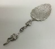 A large Continental cast silver preserve spoon. Ap