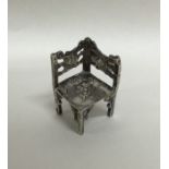 A novelty miniature silver corner chair with chase