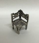 A novelty miniature silver corner chair with chase