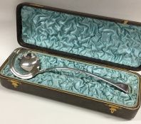 A large silver fiddle pattern sauce ladle containe