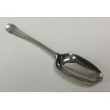 An 18th Century crested silver dessert spoon. Appr
