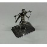 A small unusual silver table toy in the form of a