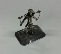 A small unusual silver table toy in the form of a