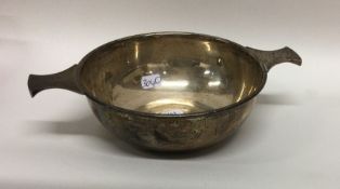 An Edwardian silver two handled quaich of plain fo