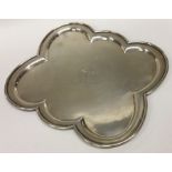 An unusual six sided silver salver with crested ar