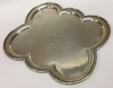 An unusual six sided silver salver with crested ar