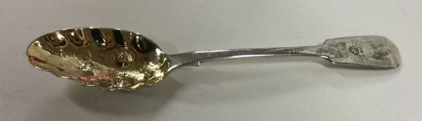 A novelty silver berry spoon with gilt bowl. Londo