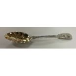 A novelty silver berry spoon with gilt bowl. Londo