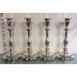 A good rare set of four Georgian silver candlestic