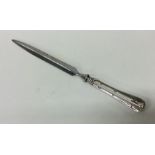 A modern silver letter opener with steel blade. Lo