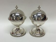 A good pair of heavy silver globular peppers with